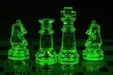 Piony szachowe szklane podświetlone na kolor zielony na czarnym tle
