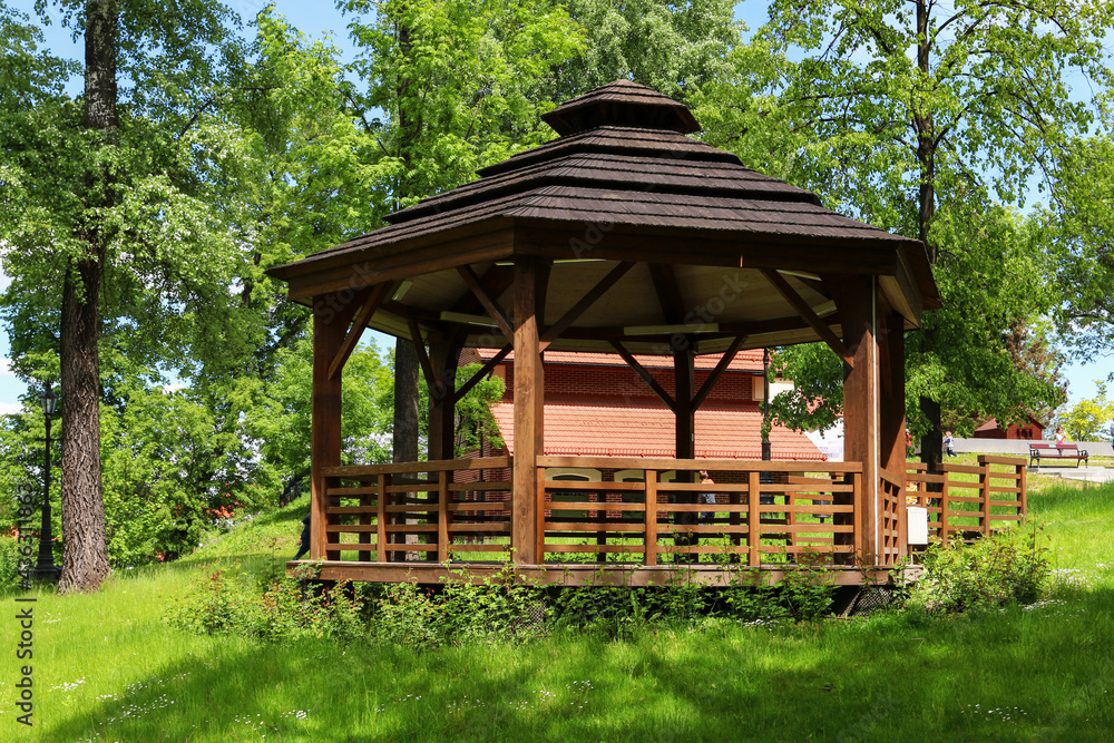 WIELICZKA, POLAND - MAY 26, 2021: Wooden gazebo in beautiful city park by the Salt Mine WIELICZKA, POLAND - MAY 26, 2021: Wooden gazebo in beautiful city park by the Salt Mine
