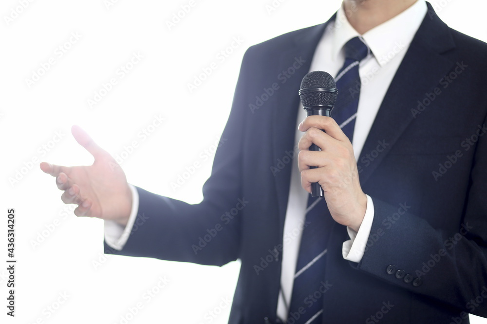 Businessman giving presentation with microphone Businessman giving presentation with microphone