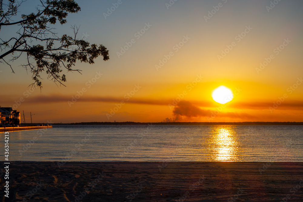 Suburban waterfront homes on early morning light or sunset light