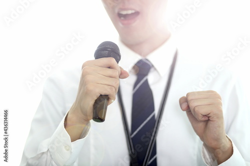 Businessman giving presentation with microphone 