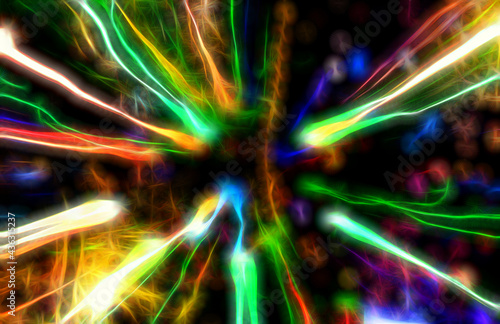 Abstract motion defocused lights on dark background, glowing effect
