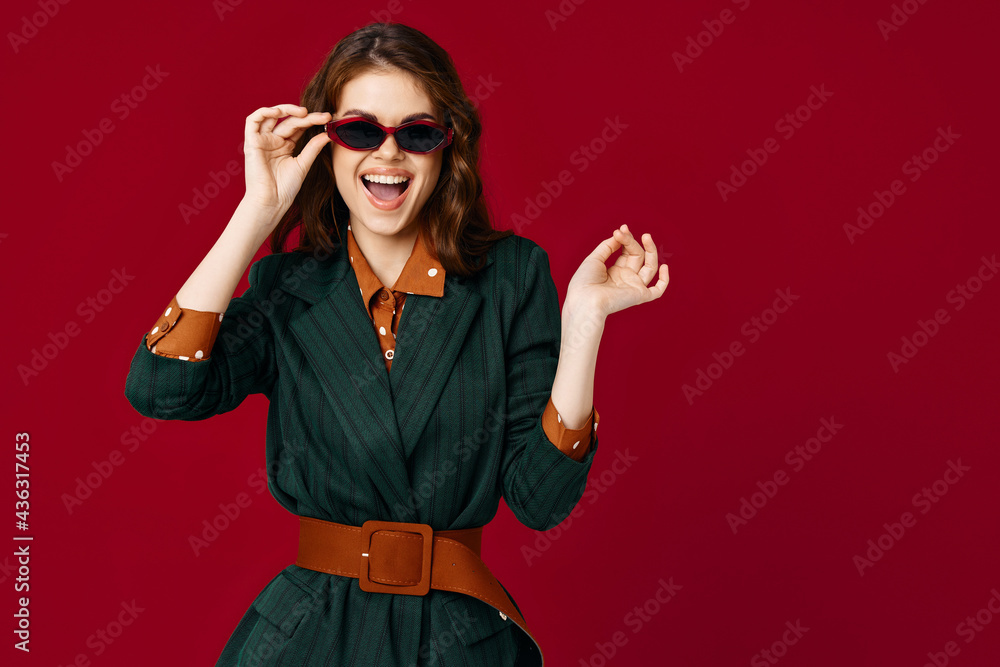 woman with open mouth wearing sunglasses fashionable suit red background woman with open mouth wearing sunglasses fashionable suit red background