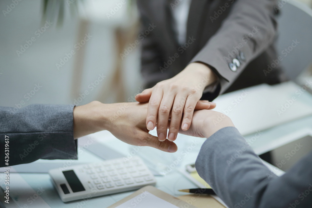 Close-Up Of Business People Stacking Hands Close-Up Of Business People Stacking Hands