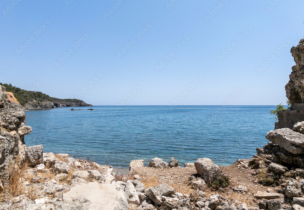 Beautiful background of stones, sky and sea at sunny day Beautiful background of stones, sky and sea at sunny day