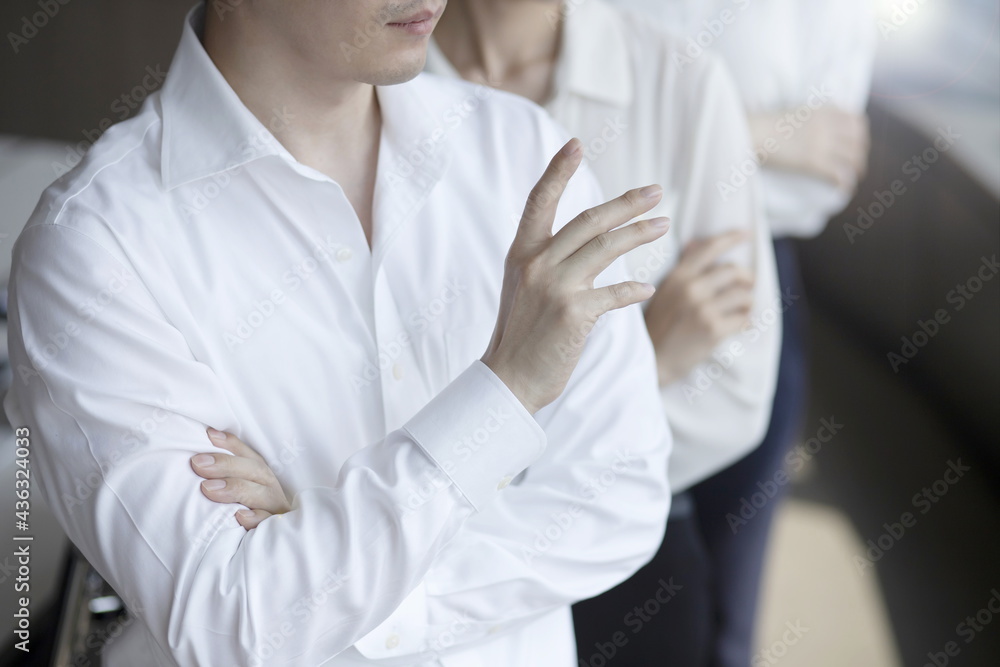 Close up of business people standing with arms folded Close up of business people standing with arms folded