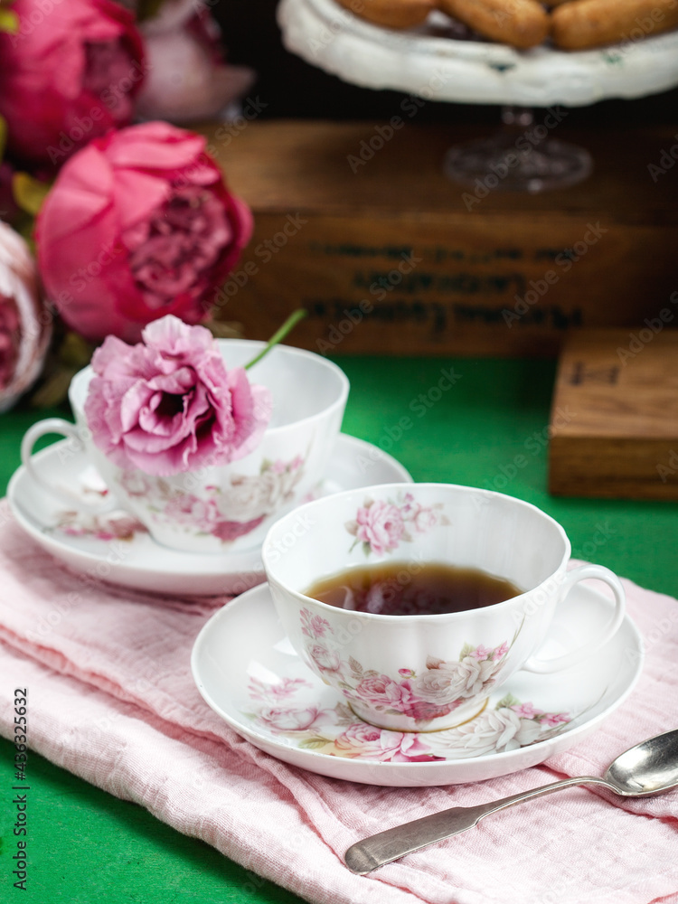 cup of tea with flowers and cookies cup of tea with flowers and cookies