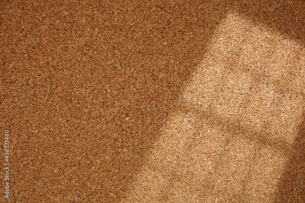 Fototapeta premium Shadow Line From the Window on Cork Board. Cork background with blinds light and shadows