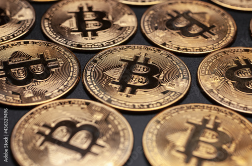 bitcoin gold coins cryptocurrency isolated on black background, selective focus pattern