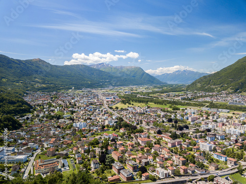 Aerial image of Bellinzona, the capital city of the Swiss Canton Ticino, with Castle Montebello and Castle Grande in view. photo