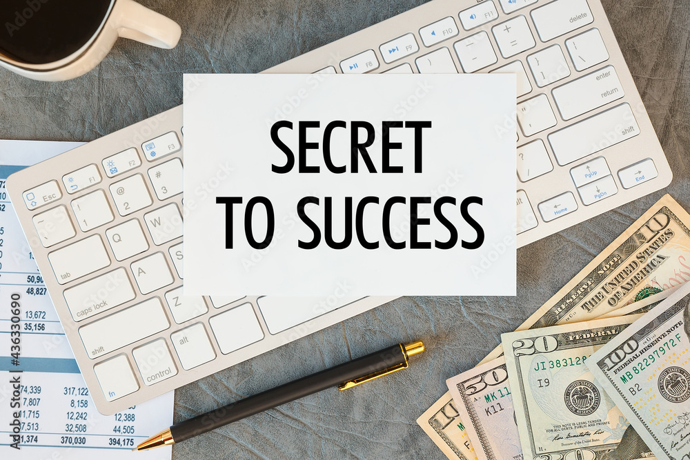 Fototapeta premium Secret To Success is written in a document on the office desk, keyboard and diagram