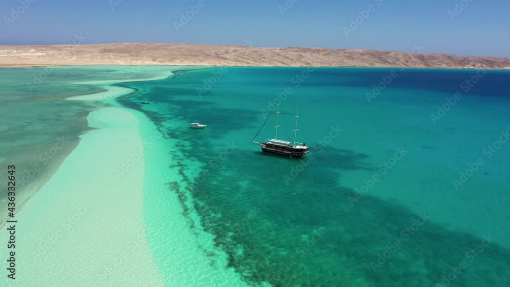 Aerial view: Boat in a beautiful lagoon in the Red sea, Egypt Aerial view: Boat in a beautiful lagoon in the Red sea, Egypt