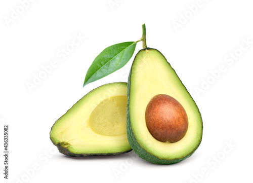 Avocado cut in half with  leaf isolated on white background.