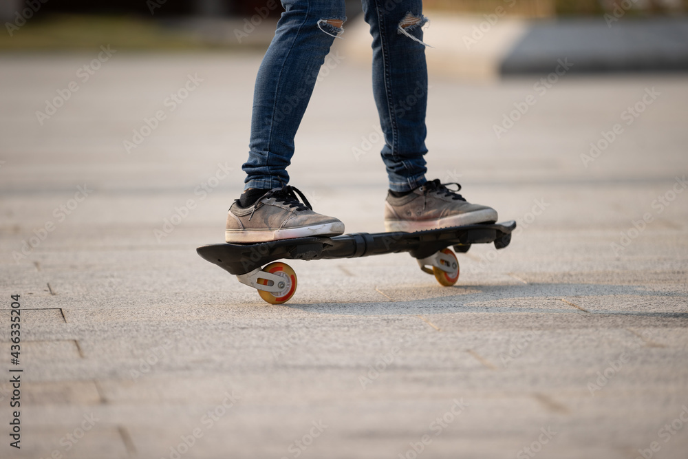 Skateboarder legs skateboarding at outdoors