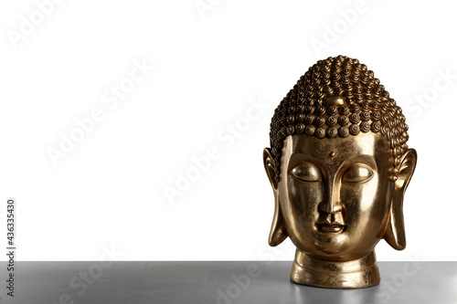Beautiful golden Buddha sculpture on table against grey background. Space for text