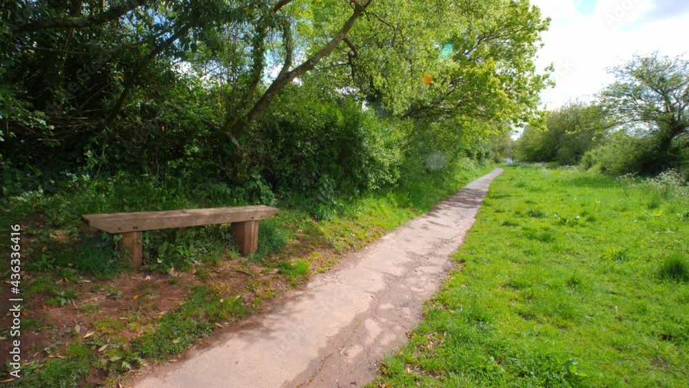 Wooden Bench on a Country path in Marldon, Devon, England Wooden Bench on a Country path in Marldon, Devon, England