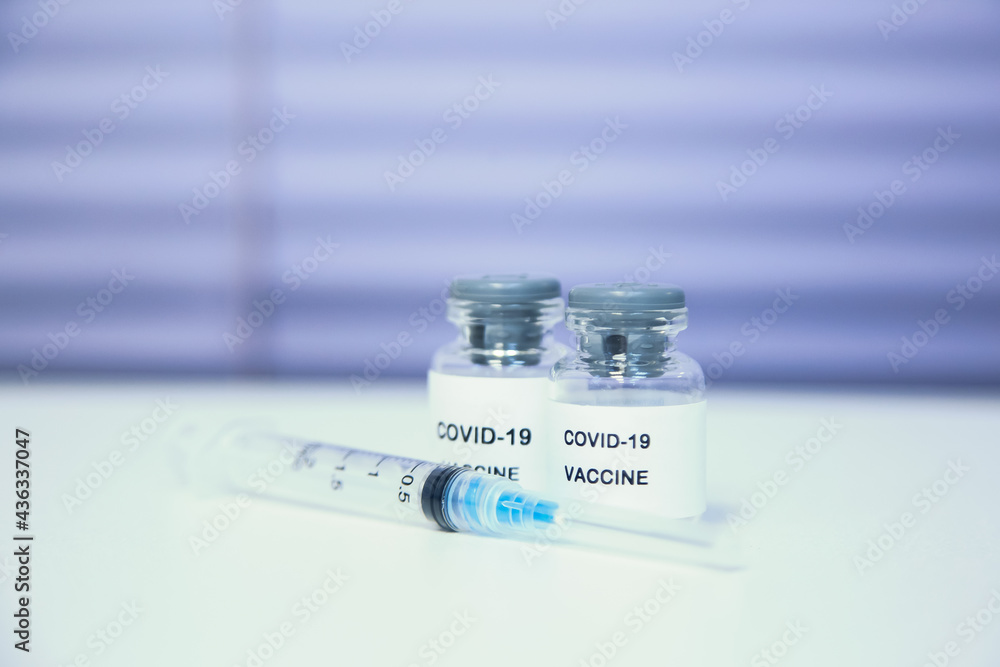 Coronavirus COVID-19 Vaccine Vials and Syringe. COVID-19 vaccine close up Coronavirus COVID-19 Vaccine Vials and Syringe. COVID-19 vaccine close up