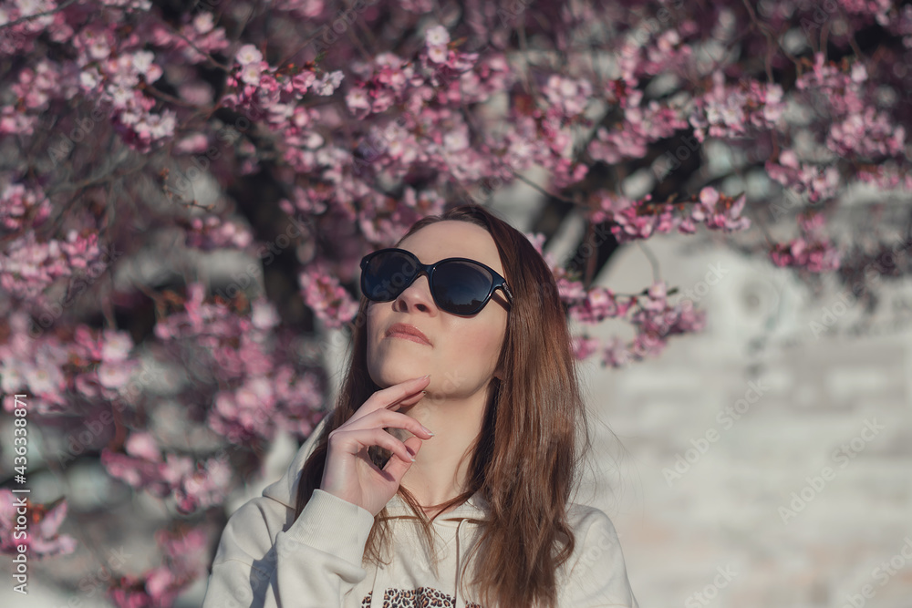 girl on the background of sakura girl on the background of sakura