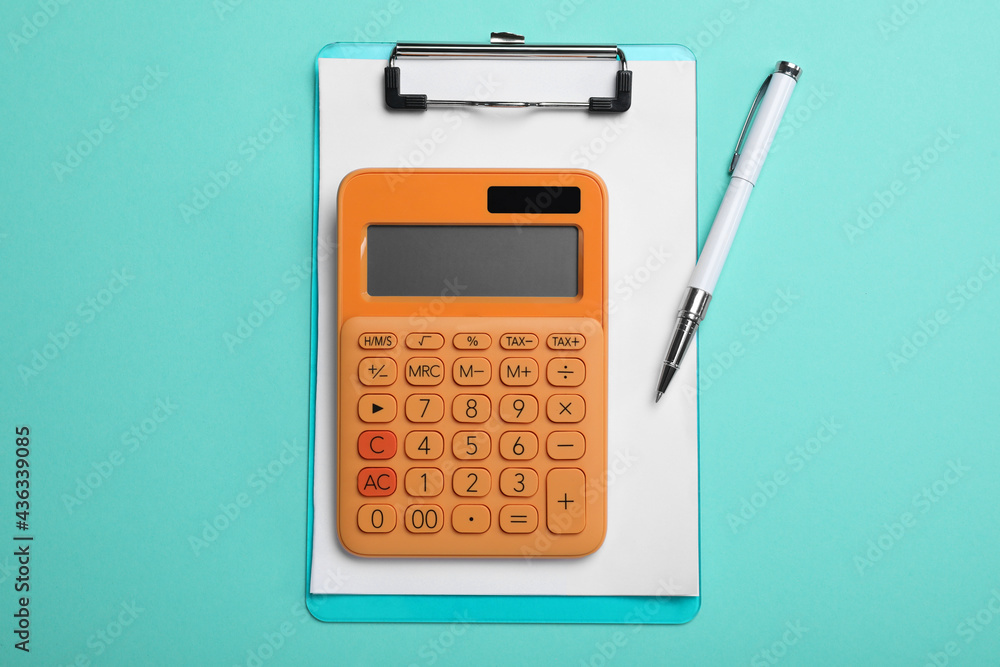 Calculator, clipboard and pen on light blue background, flat lay Calculator, clipboard and pen on light blue background, flat lay