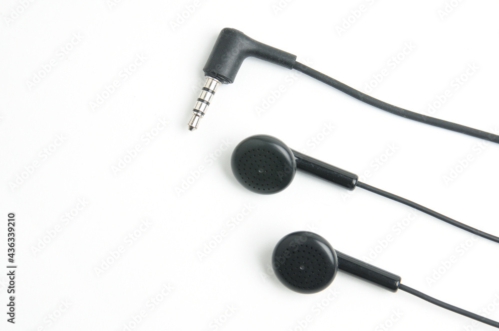 Earphone for music player and smartphone on white background Earphone for music player and smartphone on white background