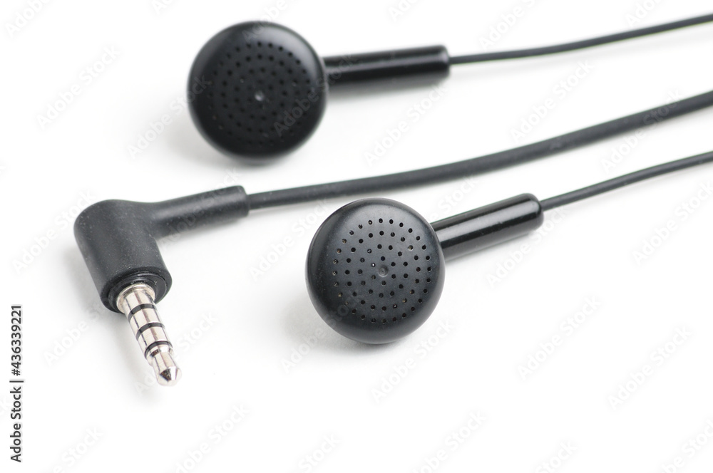Earphone for music player and smartphone on white background Earphone for music player and smartphone on white background