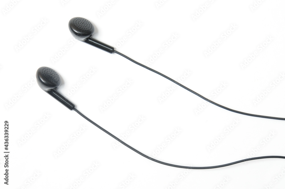 Earphone for music player and smartphone on white background Earphone for music player and smartphone on white background