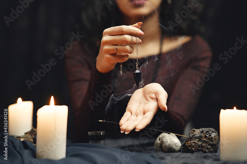 Portrait of fortune-teller in a dark room photo