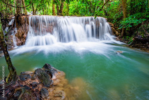 Fototapeta Naklejka Na Ścianę i Meble -  Waterfall and blue emerald water color in Huay Mae Khamin national park. Huay Mae Khamin, Beautiful nature rock waterfall steps in tropical rainforest at Kanchanaburi province, Thailand
