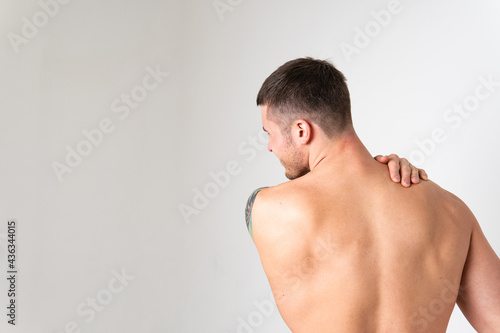 The muscles of the neck in a man on a white background are hurt ache hurt ill person male background medical, muscular chronic. Tension red care, lower suffer attractive