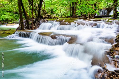 Waterfall and blue emerald water color in Huay Mae Khamin national park. Huay Mae Khamin, Beautiful nature rock waterfall steps in tropical rainforest at Kanchanaburi province, Thailand