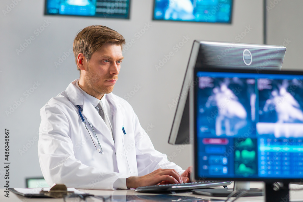 Professional medical doctor working in hospital office using computer technology. Medicine, cardiology and healthcare. Professional medical doctor working in hospital office using computer technology. Medicine, cardiology and healthcare.