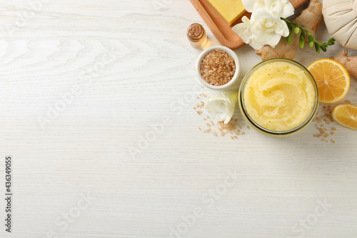Flat lay composition with body scrub on white wooden background, space for text