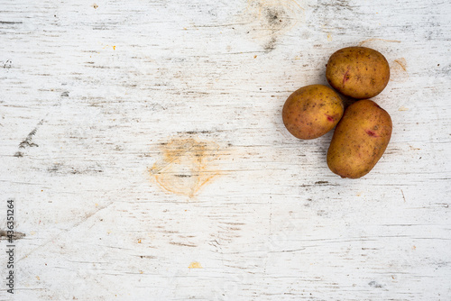 Potatoes on old wooden table