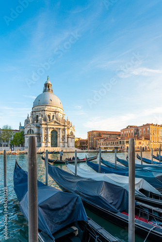 Gondolas and Santa Maria della Salute famous church, Venice, Italy