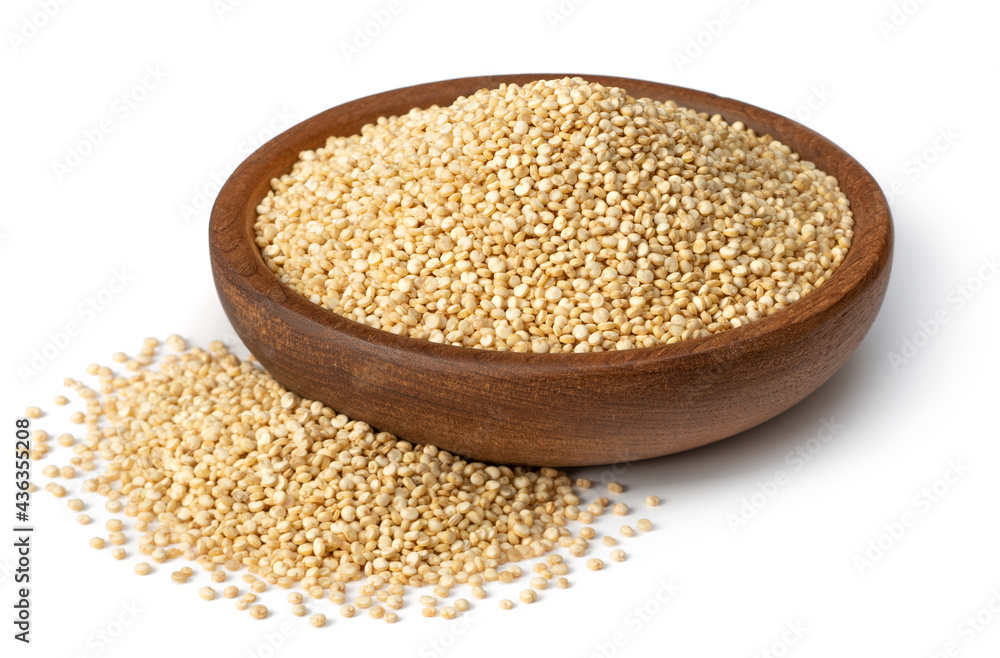 raw white quinoa in the wooden bowl, isolated on white background raw white quinoa in the wooden bowl, isolated on white background