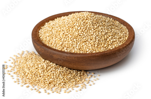 raw white quinoa in the wooden bowl, isolated on white background