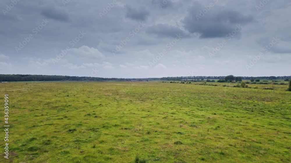 Aerial view to green spring landscape with meadow Aerial view to green spring landscape with meadow