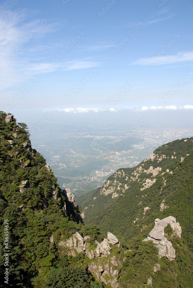 Lushan Mountain in Jiangxi Province, China. Viewpoint high on Mount Lu with views of the forest, mountain and beyond. Lushan National Park is a tourist attraction and UNESCO World Heritage Site.