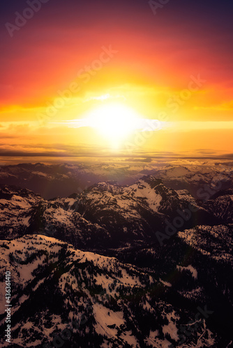 Aerial View from Airplane of Canadian Mountain Landscape in Spring time. Colorful Sunset Sky Art Render North of Vancouver, British Columbia, Canada.