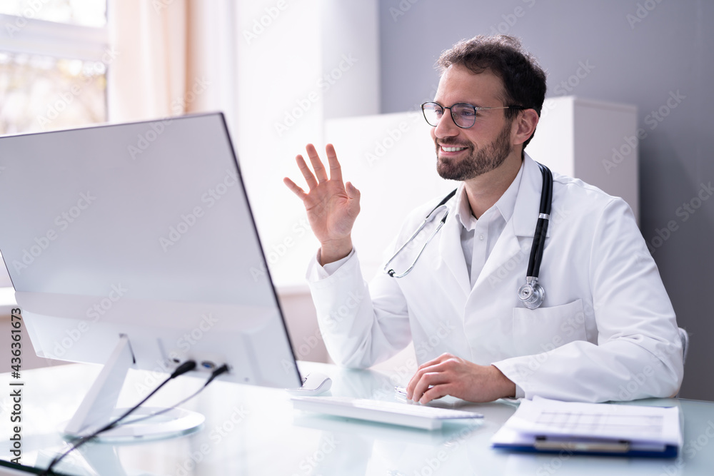 Doctor Having Video Conference On Computer Doctor Having Video Conference On Computer