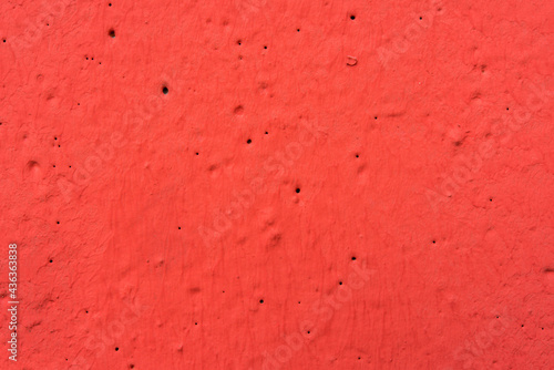 Red painted concrete wall © Georgii Shipin