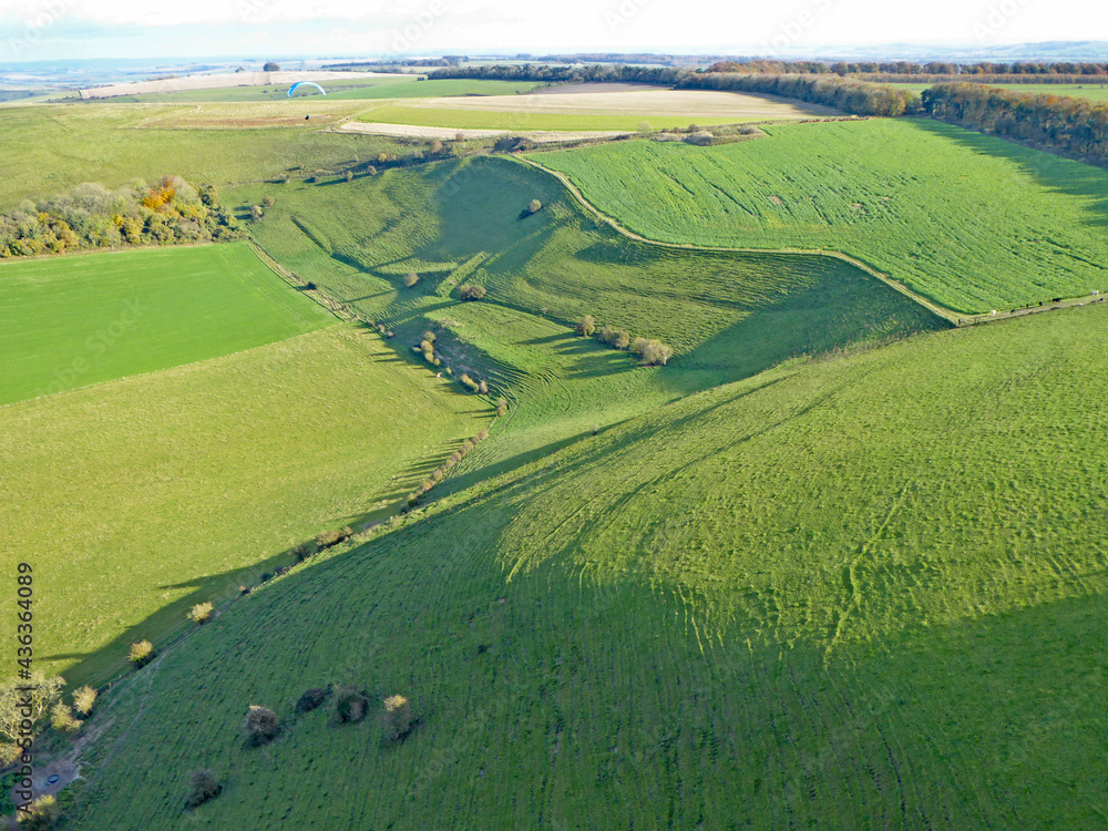 Paragliding above the fields at Monks Down in Wiltshire	
