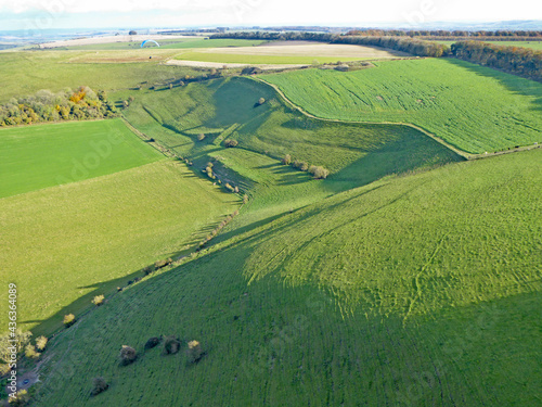 Paragliding above the fields at Monks Down in Wiltshire 