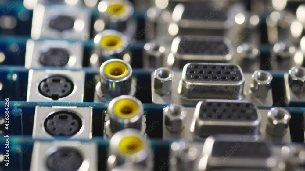 Close-up blurry metal sockets on a computer video board Close-up blurry metal sockets on a computer video board