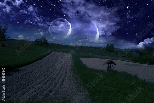 Fabulous night sky and two moons, rural landscape