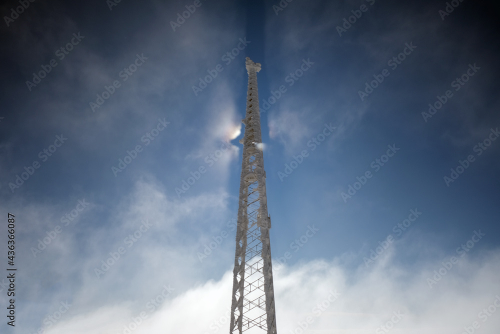 mobile phone base station pole on a sunny cloudy and foggy day mobile phone base station pole on a sunny cloudy and foggy day