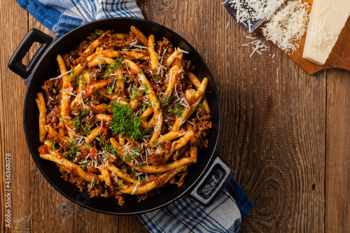 Maccheroni al ferretto with beef in ragu bolognese. Top view. photo