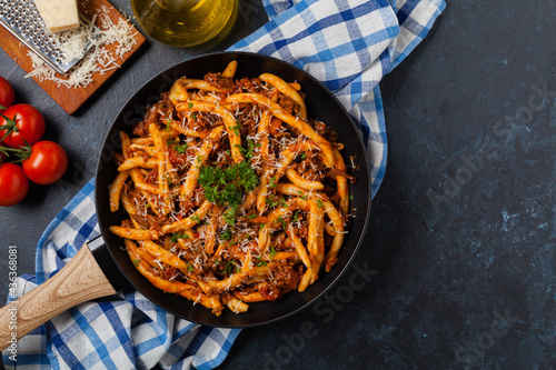 Cuadro en lienzo Maccheroni al ferretto with beef in ragu bolognese. Top view.