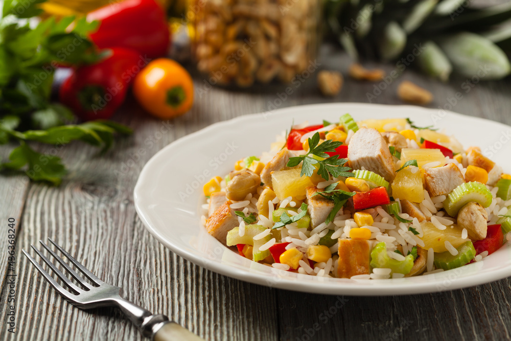 Salad with rice, chicken, peanuts and vegetables. Front view. Salad with rice, chicken, peanuts and vegetables. Front view.