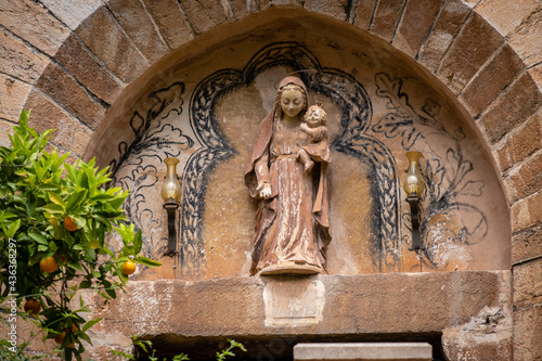 sculpture of the virgin over the entrance, Nativitat de la Mare de Déu church, Fornalutx,Mallorca, Balearic Islands, Spain